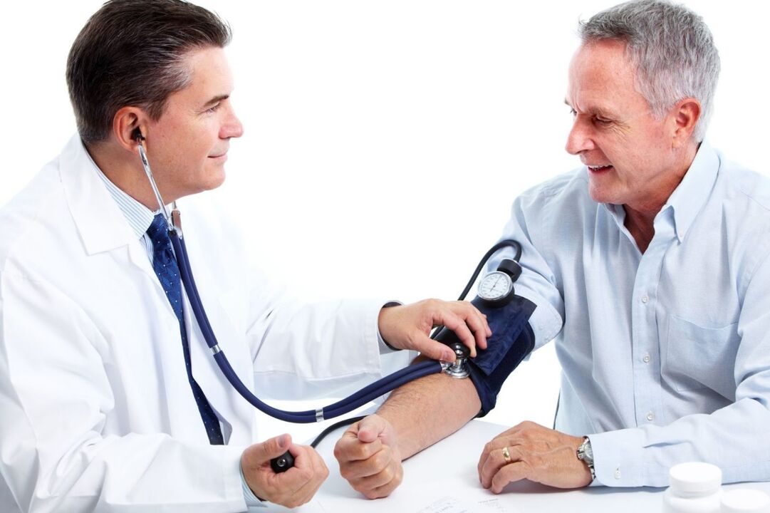 The doctor measures the pressure of the patient with hypertension